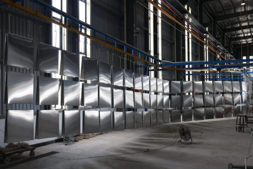 Powder coating booth and conveyor