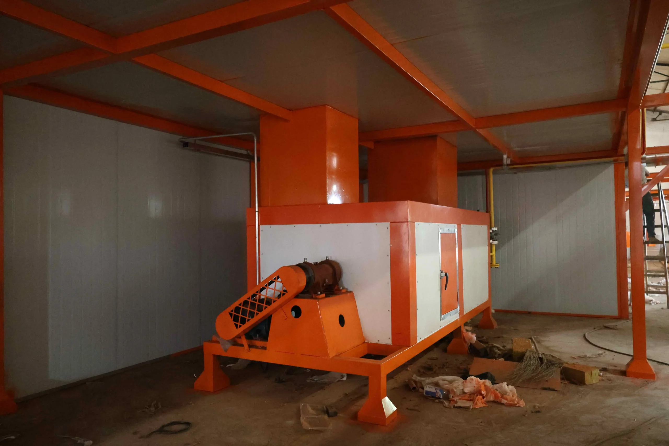 Installation team assembling equipment at customer factory