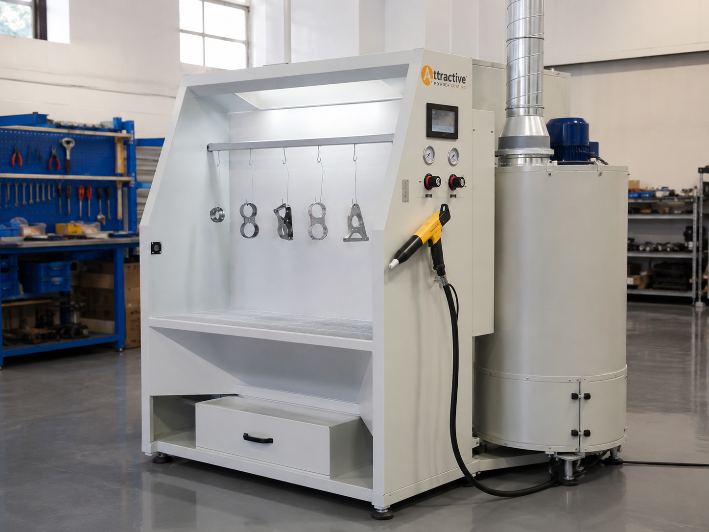 Operator using electrostatic spray gun inside powder spraying cabinet